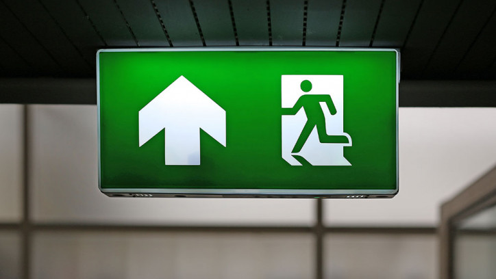 Sign in a building showing emergency exit route
